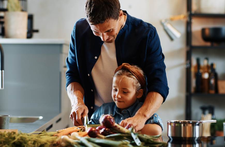 Father and daughter preparing meal